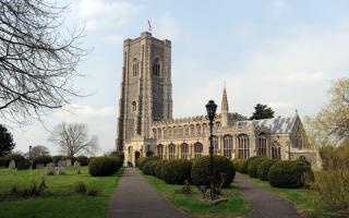 A headstone and some outdoor lights were damaged at a Suffolk church.