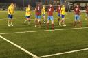 AFC Sudbury players (yellow) prepare to attack from another corner routine, although Deeping Rangers scored on the break from this set piece to go 2-1 up. Picture: CARL MARSTON