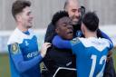 Bury manager Ben Chenery celebrates with his players at the final whistle Photo: PAUL VOLLER