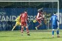 Leon Ottley-Gooch volleys home the equaliser for Felixstowe & Walton United in their 2-1 victory over Leiston. Image: PAUL VOLLER