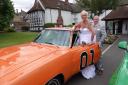 Sonya and David and the General Lee at their wedding