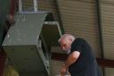 Steve returns Barn Owl chicks to their nest box after they were fitted with lightweight leg rings as part of the Suffolk Community Barn Owl project, which he founded in 2005.