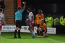 Louis Thompson of Stevenage receives a yellow card - and a suspension. Picture: TGS PHOTO