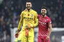 Aro Muric, left, and Sam Morsy celebrate Ipswich Town's historic win at Spurs