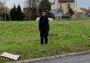 Adam Robertson, a member of Residents Against Noise and Speed (RANS) in Kessingland, looks over at a damaged sign on the roundabout south of Jaydene Caravan Park.