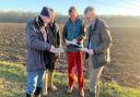 James Cartlidge, right, with local residents on the route of the proposed power lines.