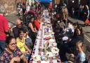 Bathed in sunshine, they got together for a big game of pass the parcel as part of the celebrations Picture: ADAM HOWLETT