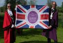 Mayor of Bungay, Tony Dawes, and Bungay Town Reeve, Olly Barnes, with the Jubilee flag.