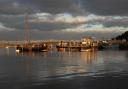 The sun sets on the water at Pin Mill.