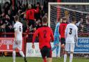 Luke Ingram leaps into the air after firing Needham Market ahead against Dartford in their FA Trophy match. Needham won 1-0