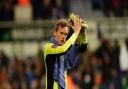 Christian Walton applauds fans after the game.