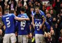 Conor Chaplin celebrates with teammates after scoring Towns second against Accrington