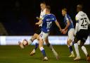 Luke Woolfenden closes down at Boundary Park.