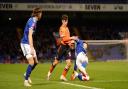 Lee Evans battles with Benny Couto in the first staging for the clash with Oldham