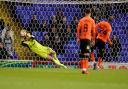 Christian Walton saves an Oldham Athletic penalty, taken by Dylan Bahamboula.