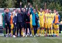 The AFC Sudbury players and management acknowledge their fans at the end of the game after beating Dartford to reach the First Round of the FA Cup.