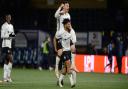 Ipswich Lee Evans and Macauley Bonne players celebrate the 4-1 win on the final whistle at Adams Park.