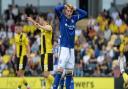 Joe Piggott is just off target with a header at Burton Albion.