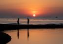 The sunrises over the calm sea at Shingle Street on the hottest day of the year.  Picture: SARAH LUCY BROWN