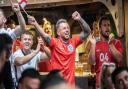 Crowds celebrate England's goal against Italy in the first half