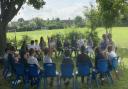 Pupils met MP James Cartlidge outside at Stratford St Mary Primary School