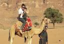 Justin and Oscar on a camel ride in Jordan