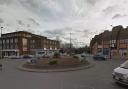 A car has crashed onto the roundabout at Norwich Road.