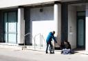 A passer by shares his food with a homeless man    Picture:SARAH LUCY BROWN