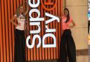 Stilt walkers welcoming excited shoppers to the new Superdry in Ipswich Picture: ARCHANT