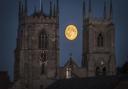 A full moon over King's Lynn Minster in 2015