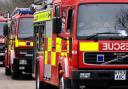 A man has been taken to hospital following a fire in Sutton Heath