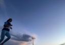 Caitlin Running with a sunset backdrop