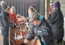 The rowing group working on the boats