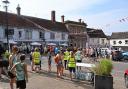 Runners gather outside the Crown hotel in Framlingham before the start of Sunday's 10k race