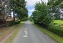 Howlett Way is closed after a car crashed into a bollard and streetlight