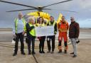 The Rotary club hands the funds over to the air ambulance