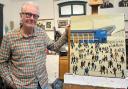 Simon Farr with his recreated Lowry painting.