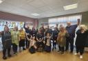 Members of East Suffolk Council, Lowestoft Town Council and the Kirkley People’s Forum celebrating the announcement at a bake sale to mark Britten’s birthday. Picture: Zeb Soanes