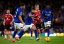 Ipswich Town skipper Sam Morsy drives through the Manchester United midfield.