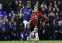 Ipswich Town's Omari Hutchinson runs away from Manchester United's Alejandro Garnacho.