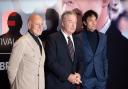 From left, Enzo Ghigo, actor Alec Baldwin and director Giulio Base pose for a photo, at the 42nd Turin Film Festival, in Turin, Italy (Matteo Secci/LaPresse via AP)