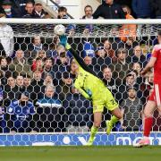 Ipswich Town keeper Christian Walton makes a fingertip first half save.