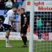 Cameron Burgess professes his innocence at Shrewsbury.