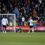 Christian Walton is beaten by Shaun WhalleyÕs late effort at Shrewsbury.