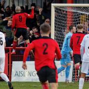 Luke Ingram leaps into the air after firing Needham Market ahead against Dartford in their FA Trophy match. Needham won 1-0