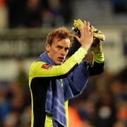 Christian Walton applauds fans after the game.