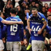 Conor Chaplin celebrates with teammates after scoring Towns second against Accrington