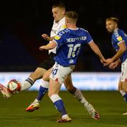 Luke Woolfenden closes down at Boundary Park.