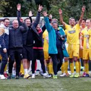 The AFC Sudbury players and management acknowledge their fans at the end of the game after beating Dartford to reach the First Round of the FA Cup.