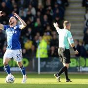 Conor Chaplin shows his frustrations with the referee at Home Park.